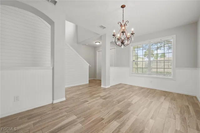 a bathroom with a sink mirror and toilet
