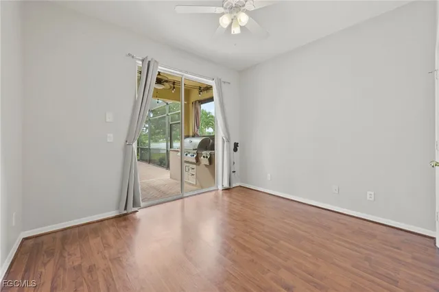 a kitchen with a refrigerator a sink stainless steel appliances and a counter top space