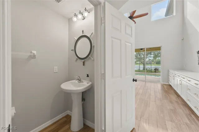 a view of a house with pool and a yard