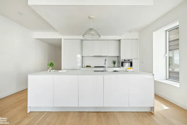a view of a dining room with furniture and window