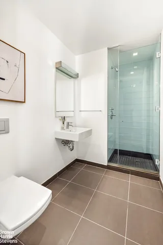 a bathroom with a sink mirror and a bathtub