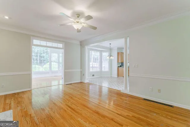 a kitchen with stainless steel appliances kitchen island granite countertop a refrigerator and a sink