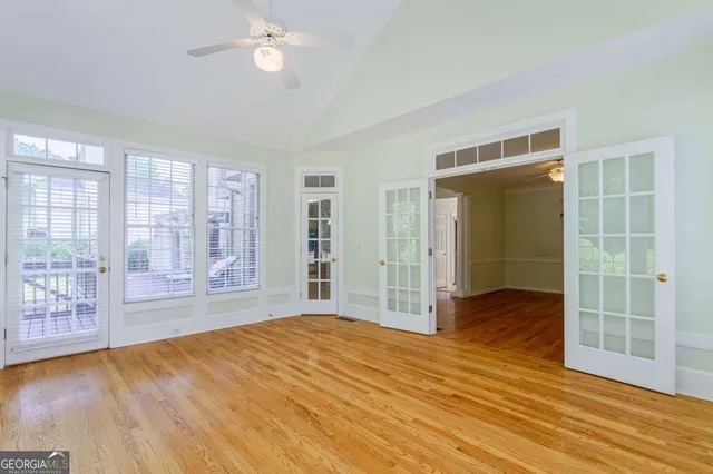 a kitchen with granite countertop a sink stove and cabinets