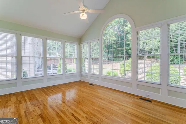a kitchen with stainless steel appliances a sink a stove a refrigerator and cabinets