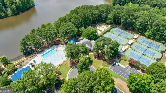 an aerial view of a house with a yard and plants