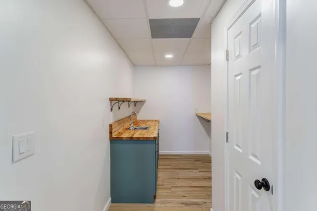 a bathroom with a glass shower door