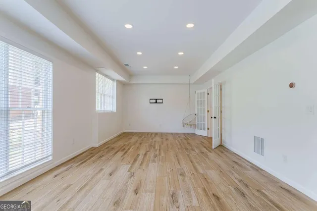 a bathroom with a sink a mirror and a shower