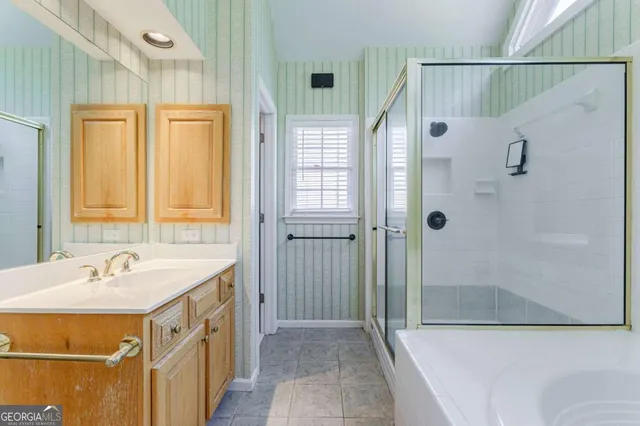 a view of a patio with a table and chairs