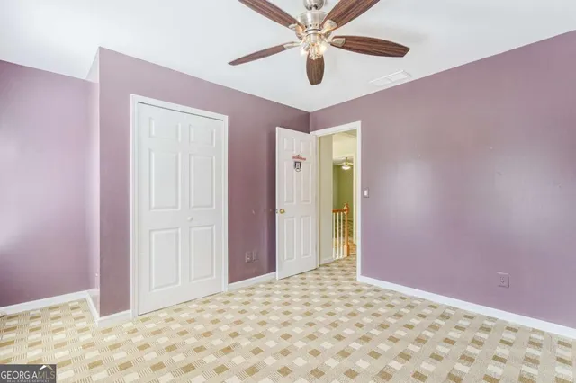 an aerial view of a house with a yard and lake view