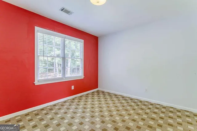 an aerial view of a house with garden space and street view