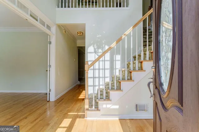 wooden floor in an empty room with glass door