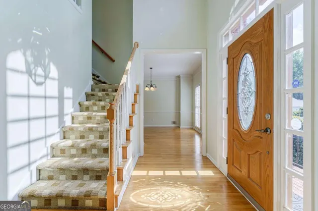 a view of an empty room with a fireplace and a window