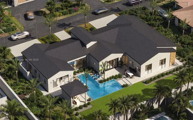 an aerial view of multiple houses with yard