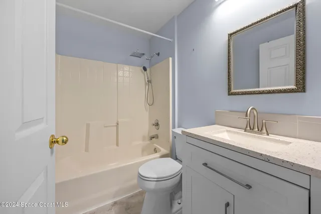 a bathroom with a sink a toilet and a bathtub