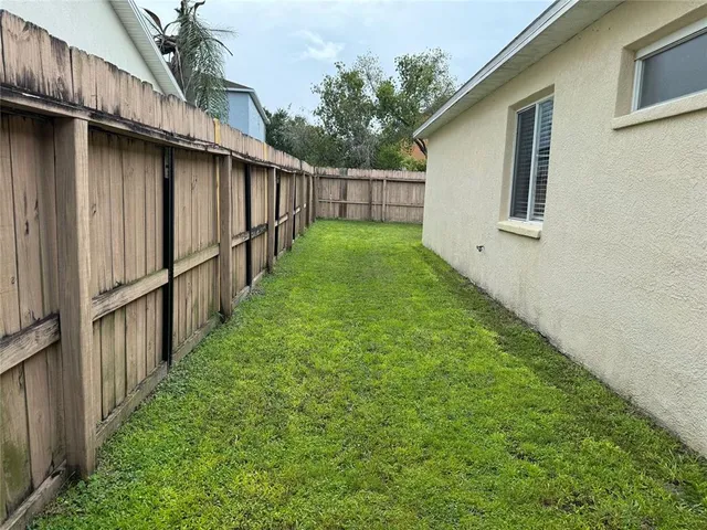 a backyard of a house with lots of green space