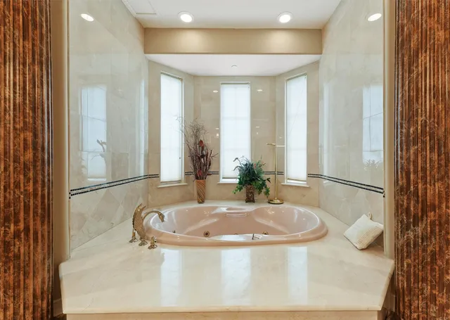 a spacious bathroom with a double vanity sink a mirror and a shower