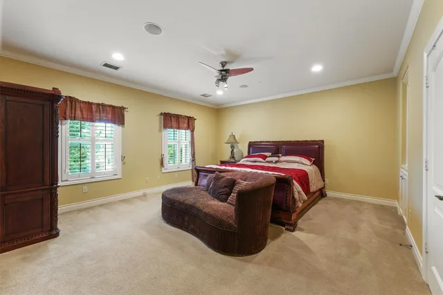 a bedroom with a bed and a chair