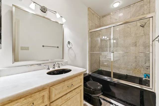 a bedroom with bed and window