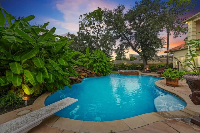 an aerial view of multiple houses with yard