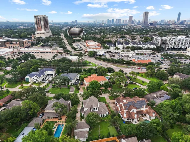 a view of a back yard of the house with a garden