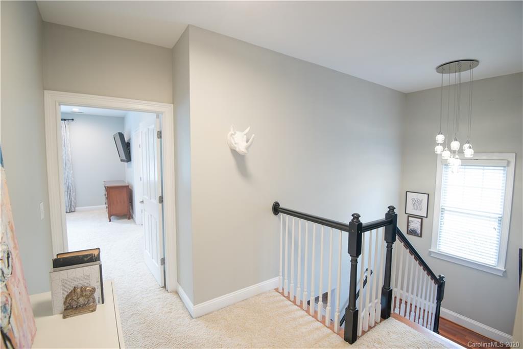 894 Promenade Walk Fort Mill, SC 29708 - Photo 14 of 45 a view of a hallway view with staircase