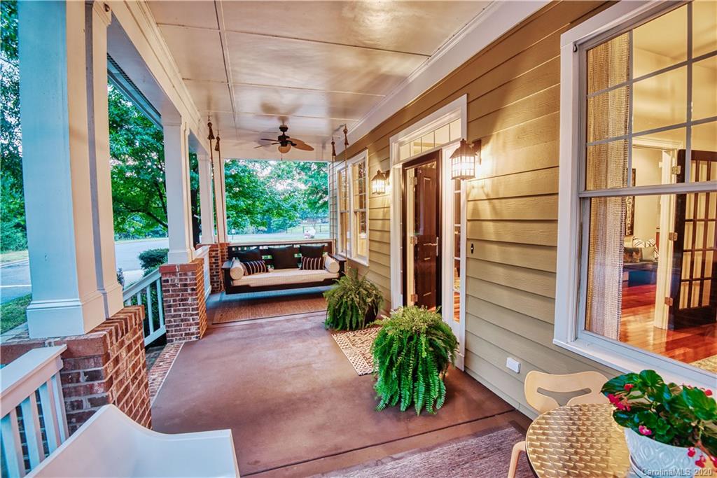 894 Promenade Walk Fort Mill, SC 29708 - Photo 3 of 45 a porch with chairs and potted plant