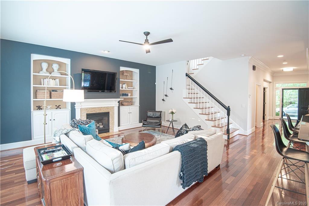 894 Promenade Walk Fort Mill, SC 29708 - Photo 8 of 45 a living room with furniture a fireplace and a flat screen tv