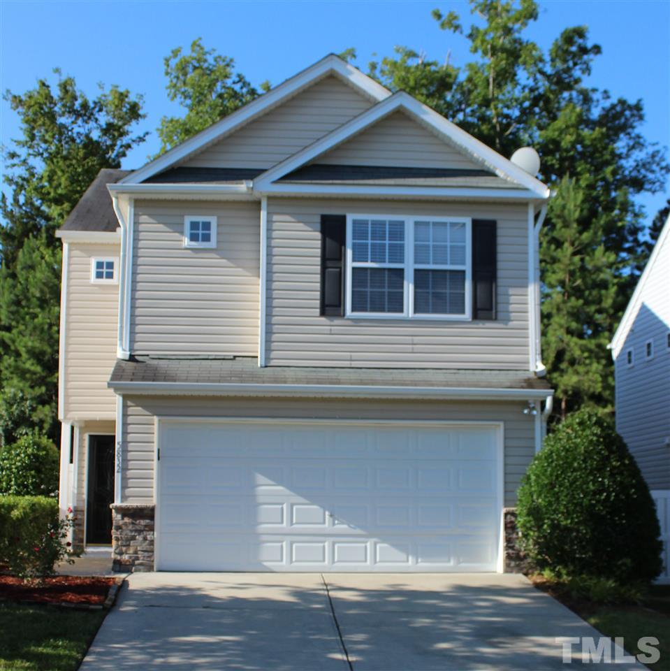 5832 Ricker Road Raleigh, NC 27610 - Photo 1 of 14 a front view of a house with a yard and garage