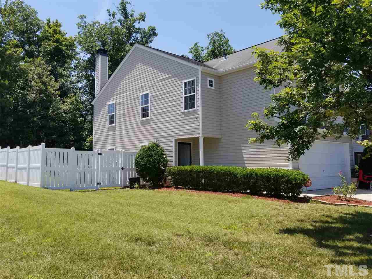 5832 Ricker Road Raleigh, NC 27610 - Photo 14 of 14 a view of a house with backyard and garden