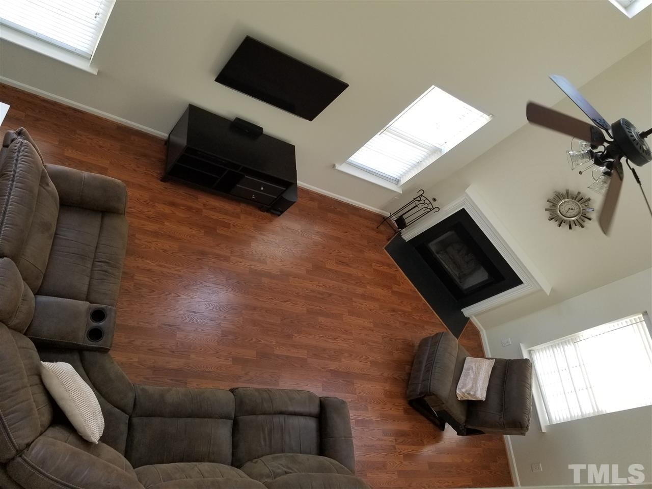 5832 Ricker Road Raleigh, NC 27610 - Photo 3 of 14 a living room with furniture and a flat screen tv