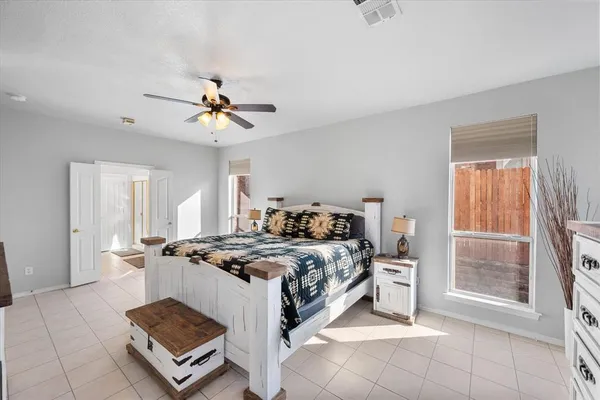 a bed room with a bed and a chandelier