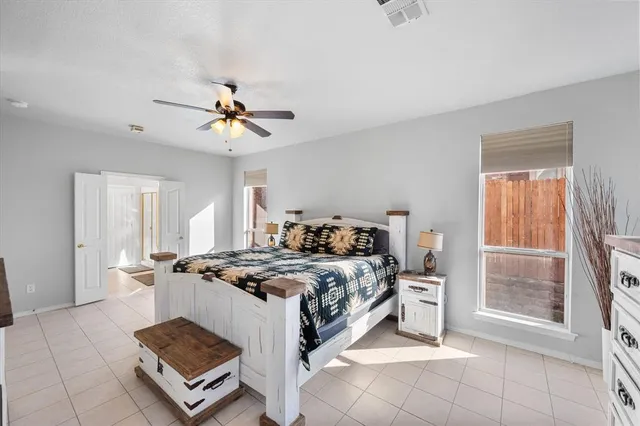 a bed room with a bed and a chandelier