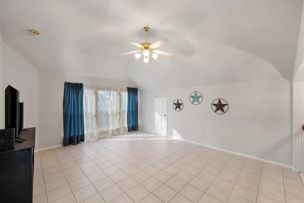 a view of a livingroom with a chandelier fan