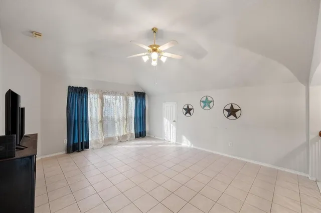 a view of a livingroom with a chandelier fan