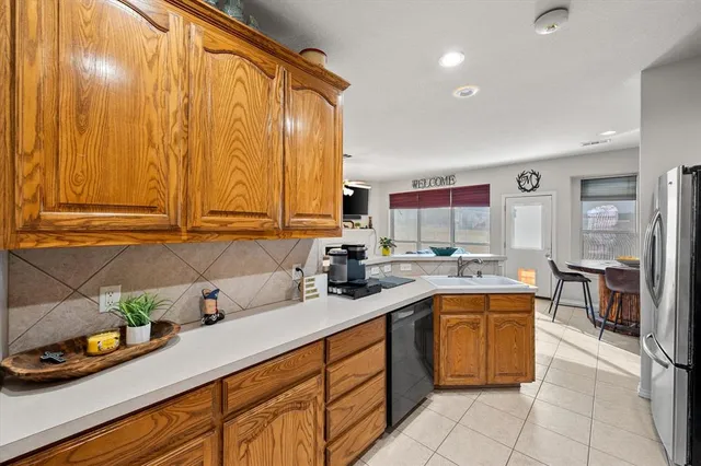 a kitchen with a sink counter top space and cabinets