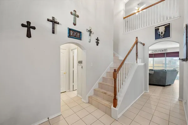a view of a livingroom with an entryway and fireplace