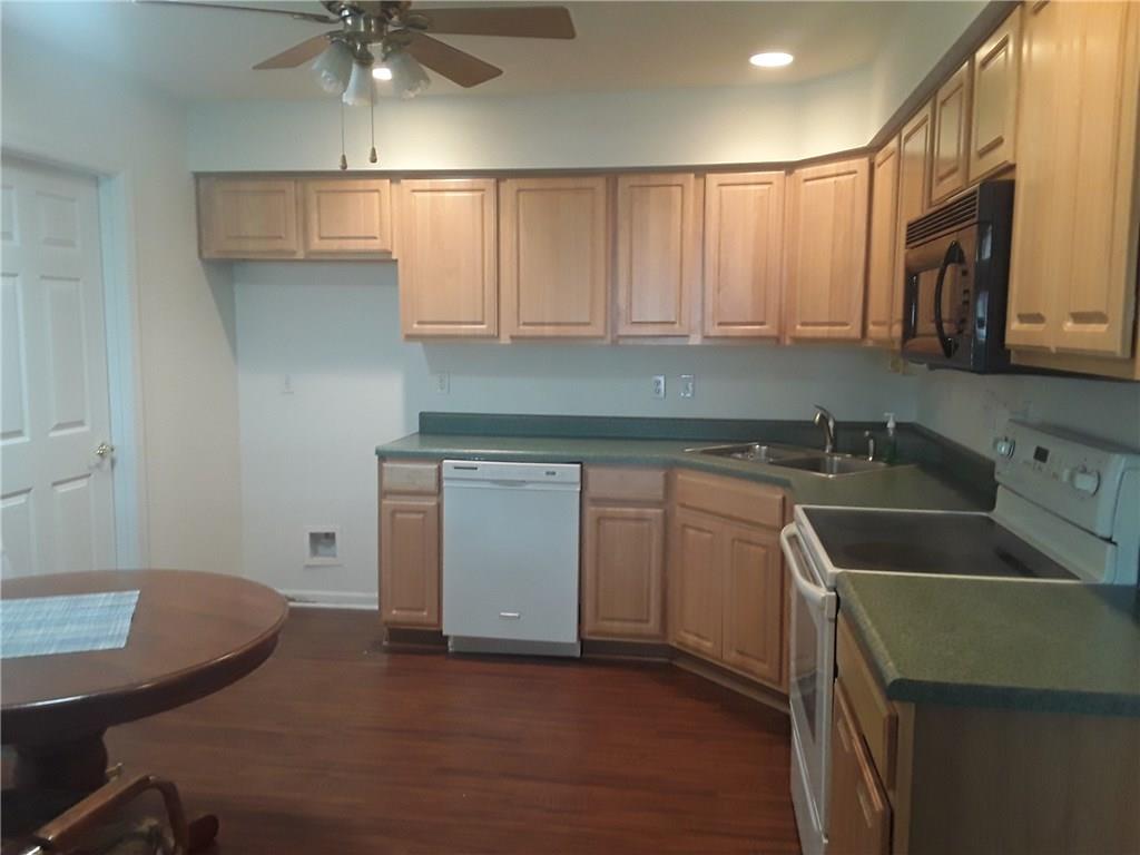 142 Rana Lane Gibsonia, PA 15044 - Photo 11 of 13 Eat in kitchen with newer laminate flooring.