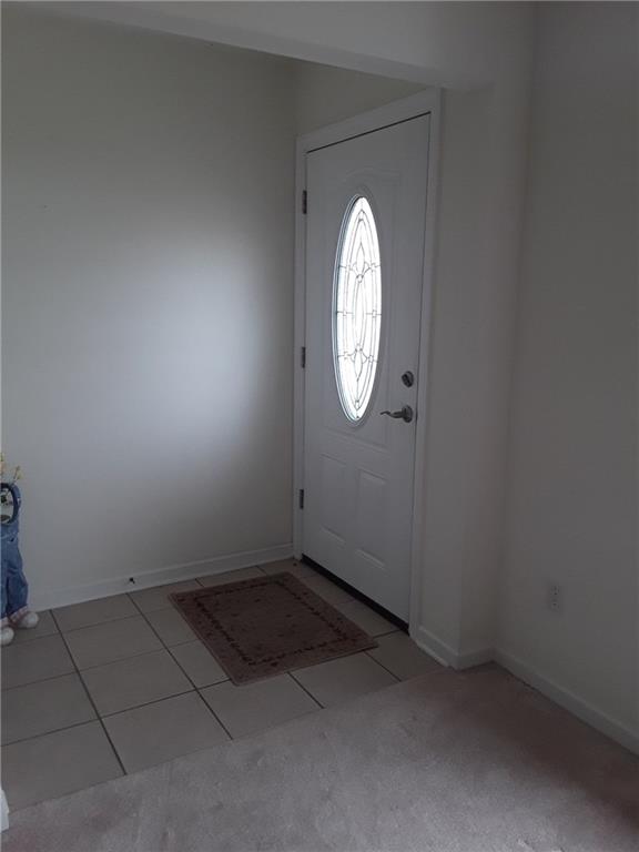 142 Rana Lane Gibsonia, PA 15044 - Photo 3 of 13 Welcoming door into living room with stained glass insert.