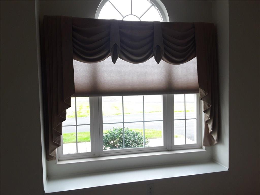 142 Rana Lane Gibsonia, PA 15044 - Photo 7 of 13 Lovely window in the living room with a nice shade and window treatment and a great window seat.
