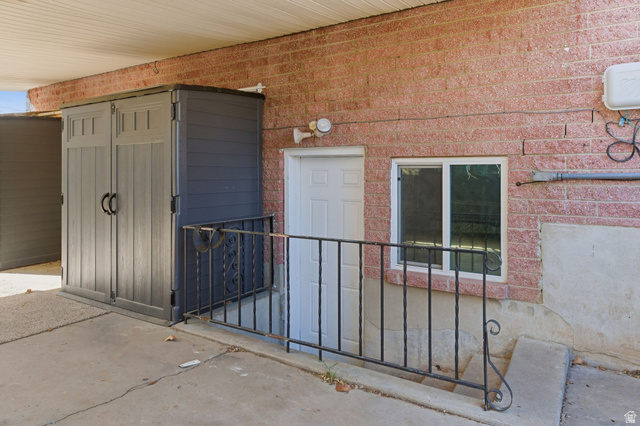 2323 North 720 West Clinton, UT 84015 - Photo 34 of 34 Doorway to property with brick siding