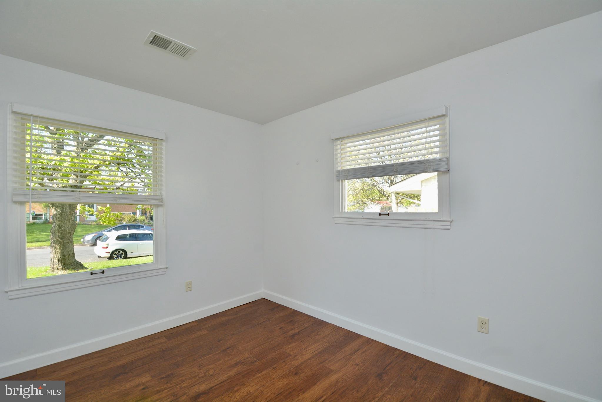 405 East Poplar Road Sterling, VA 20164 - Photo 14 of 30 Master bedroom w/hardwood laminate floors