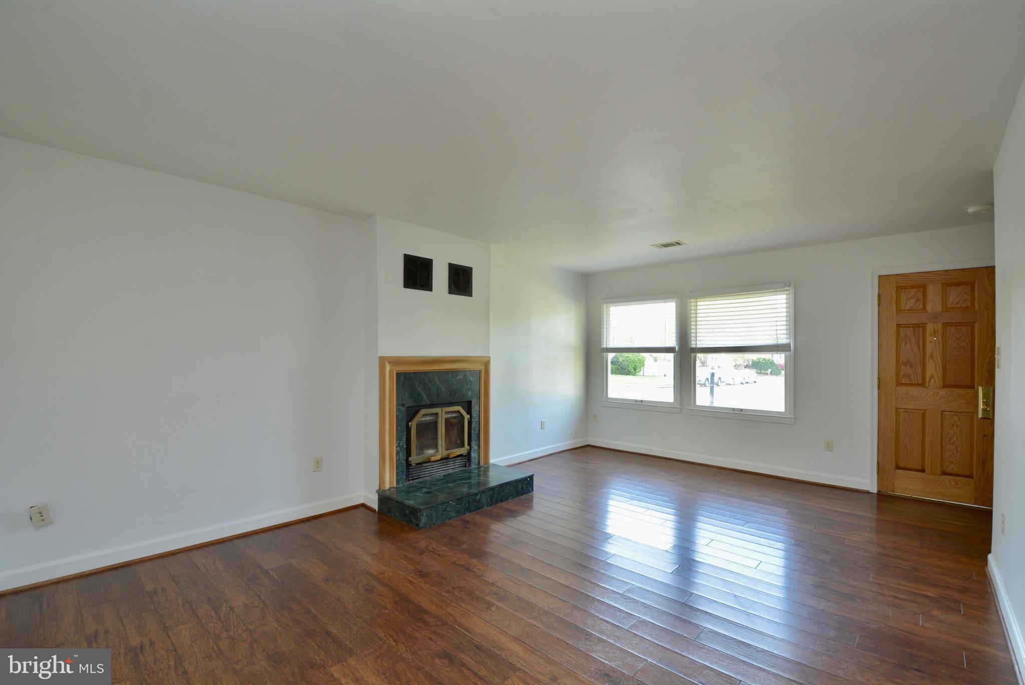 405 East Poplar Road Sterling, VA 20164 - Photo 8 of 30 Living room view to front door/outside