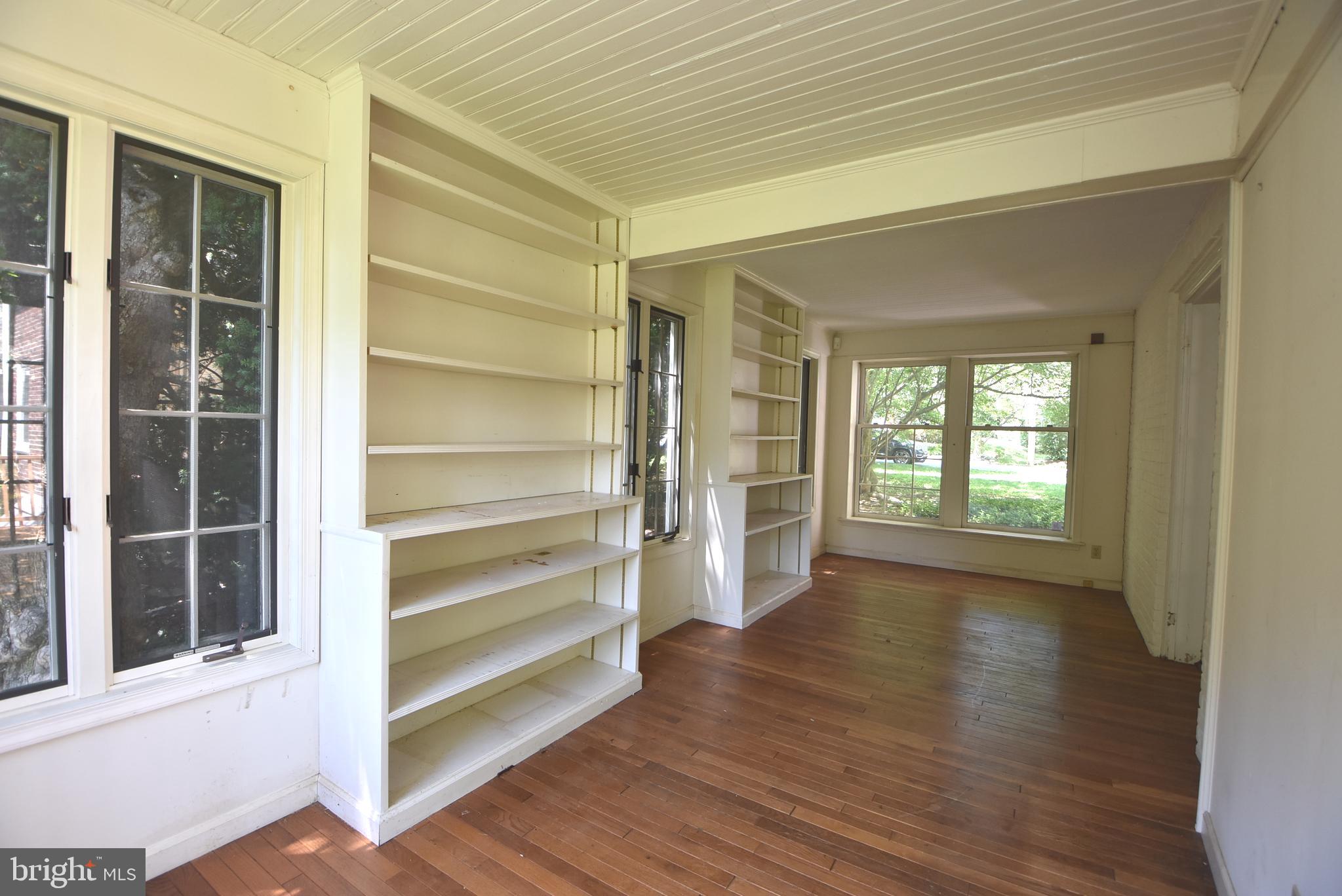 19 Farm Road Wayne, PA 19087 - Photo 11 of 41 a view of an empty room with a window and wooden floor