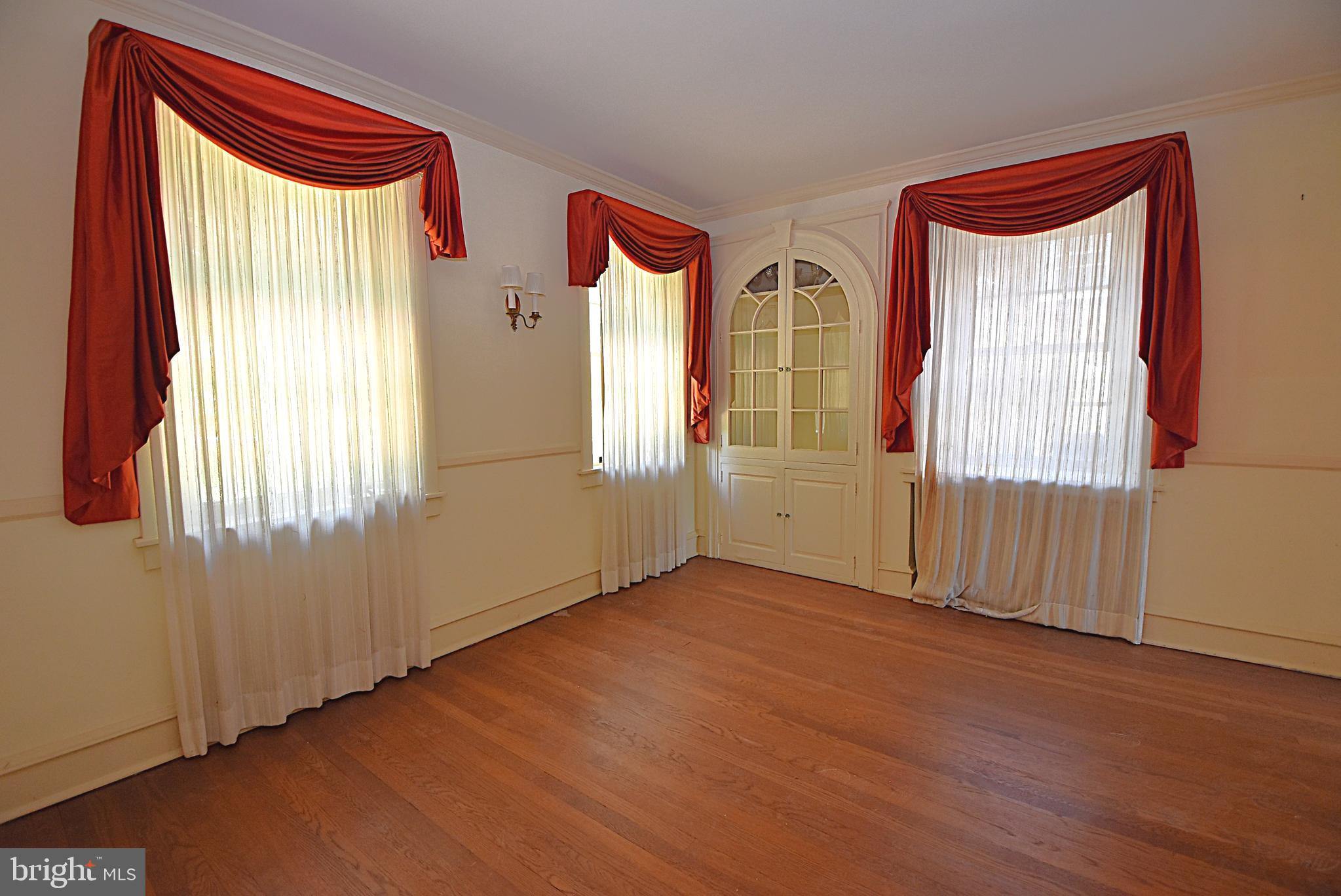 19 Farm Road Wayne, PA 19087 - Photo 12 of 41 an empty room with wooden floor and windows