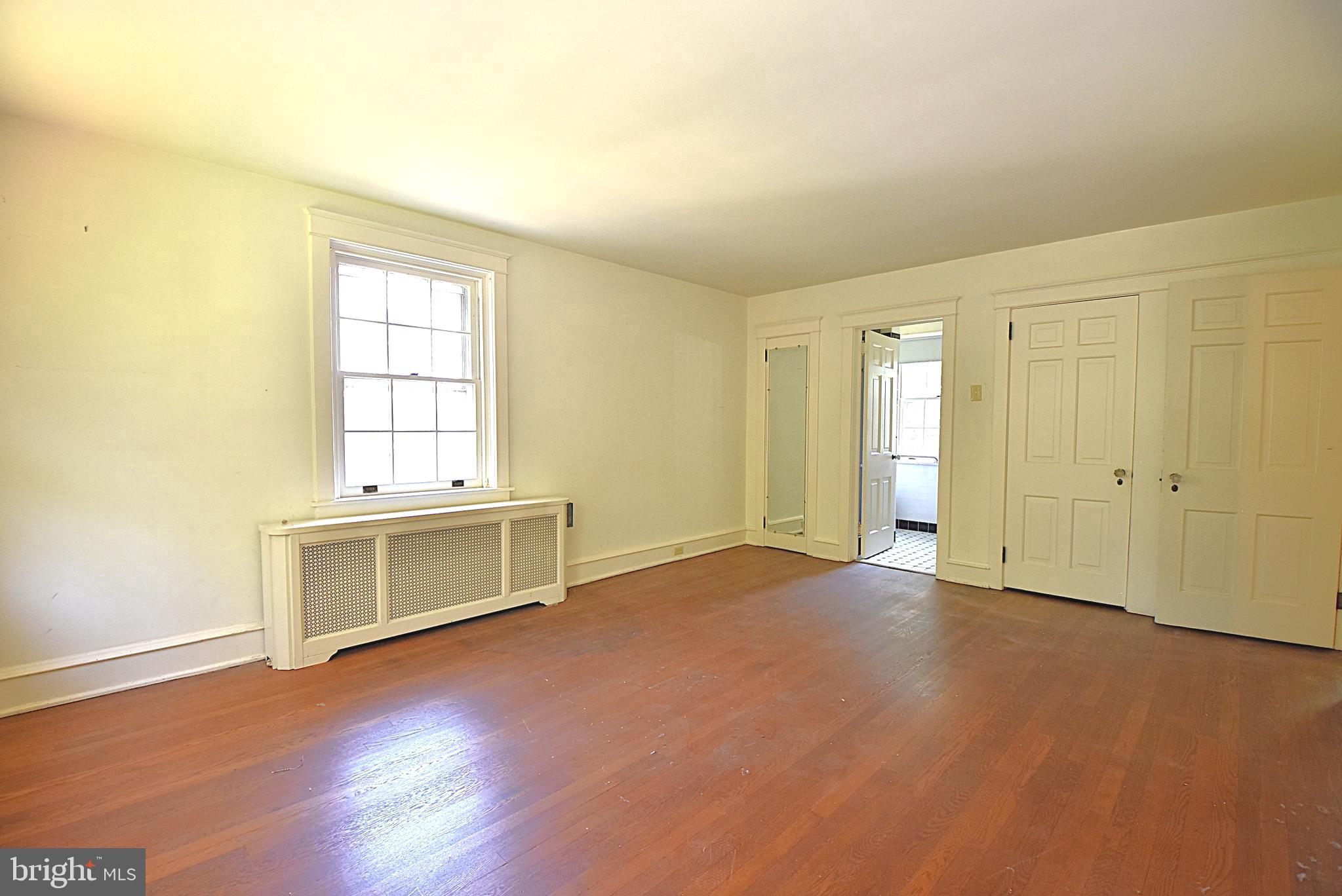 19 Farm Road Wayne, PA 19087 - Photo 16 of 41 an empty room with windows and fireplace