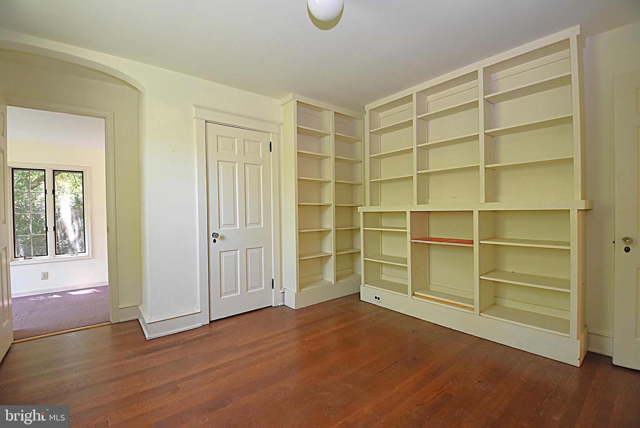 19 Farm Road Wayne, PA 19087 - Photo 20 of 41 a view of an empty room with wooden floor and a window