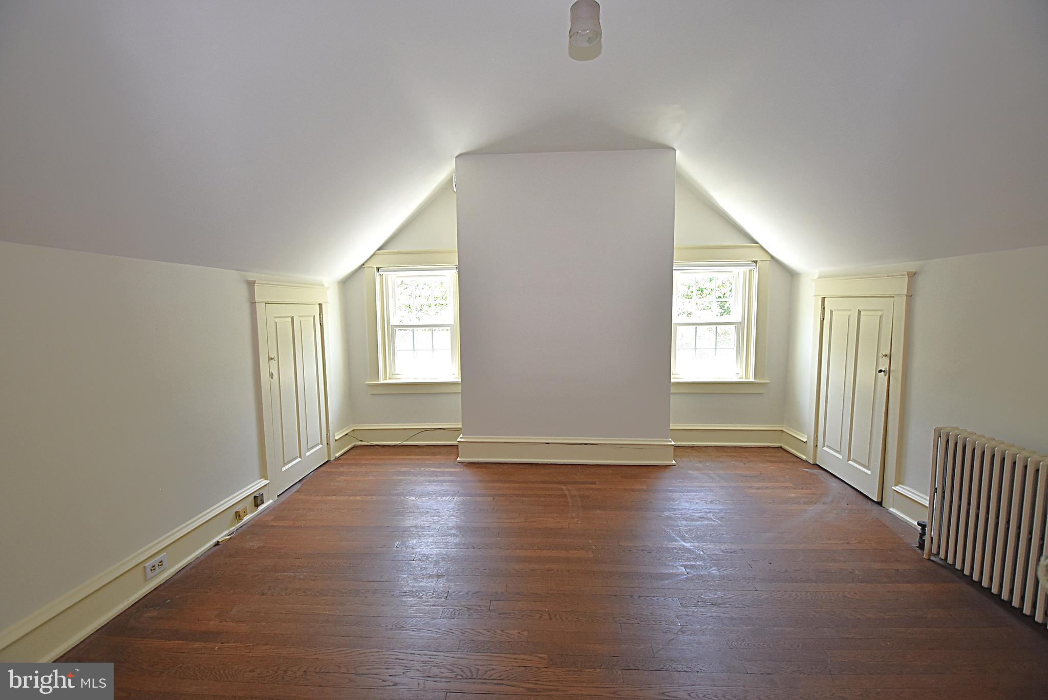 19 Farm Road Wayne, PA 19087 - Photo 24 of 41 an empty room with wooden floor and windows