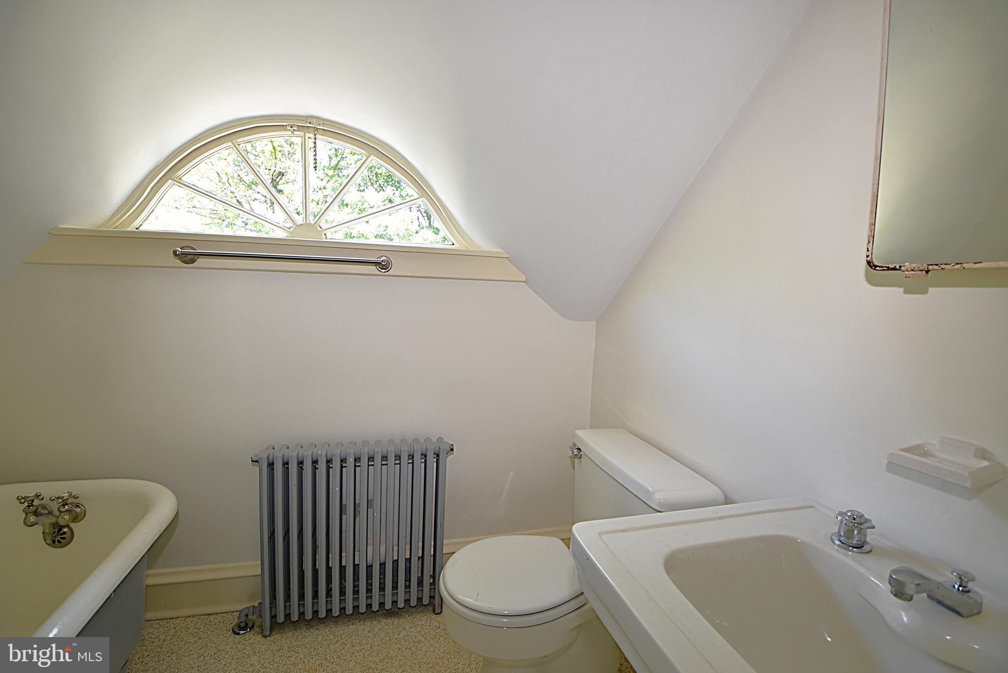 19 Farm Road Wayne, PA 19087 - Photo 26 of 41 a bathroom with a sink a toilet and a window