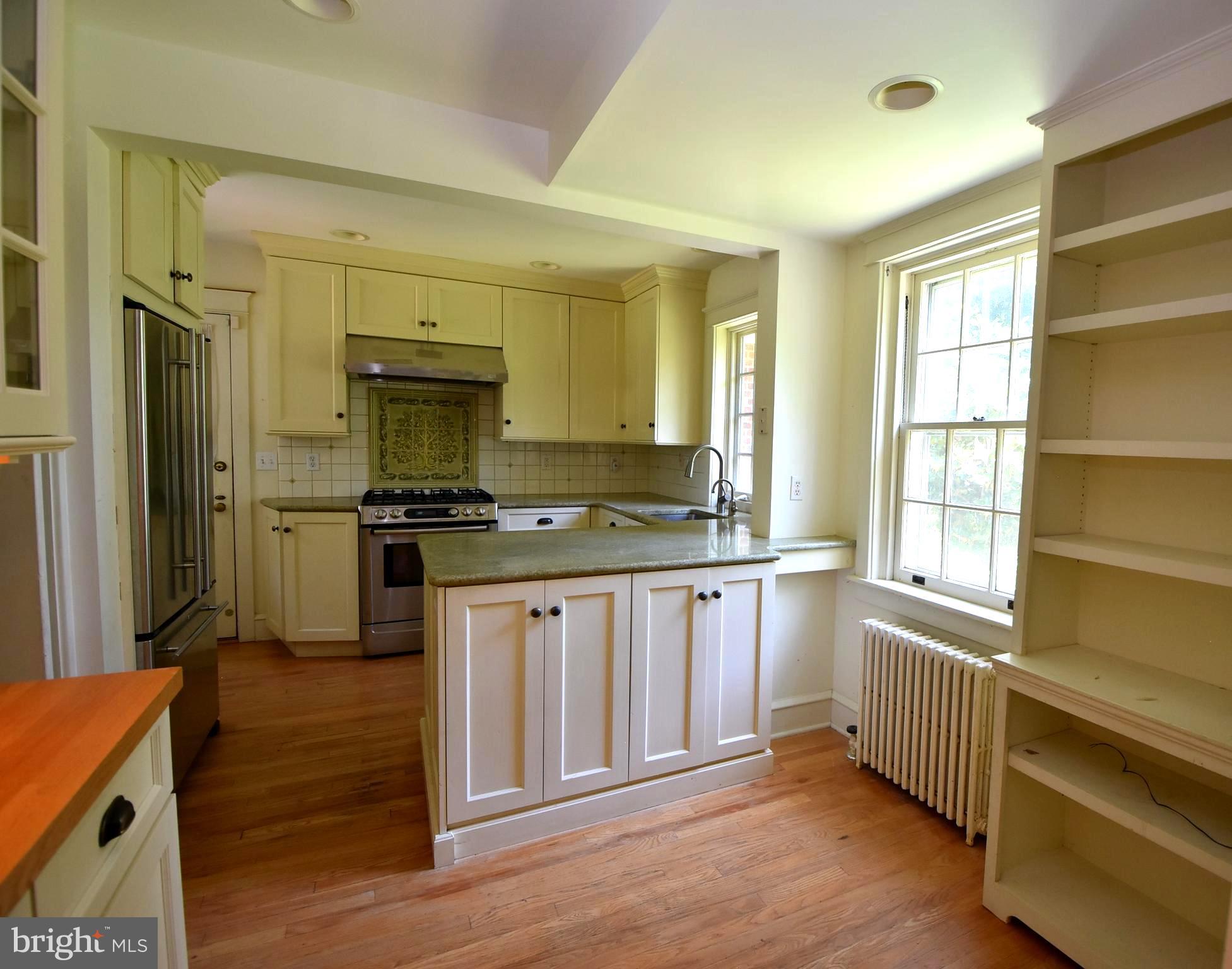 19 Farm Road Wayne, PA 19087 - Photo 3 of 41 a kitchen with stainless steel appliances a stove and a refrigerator