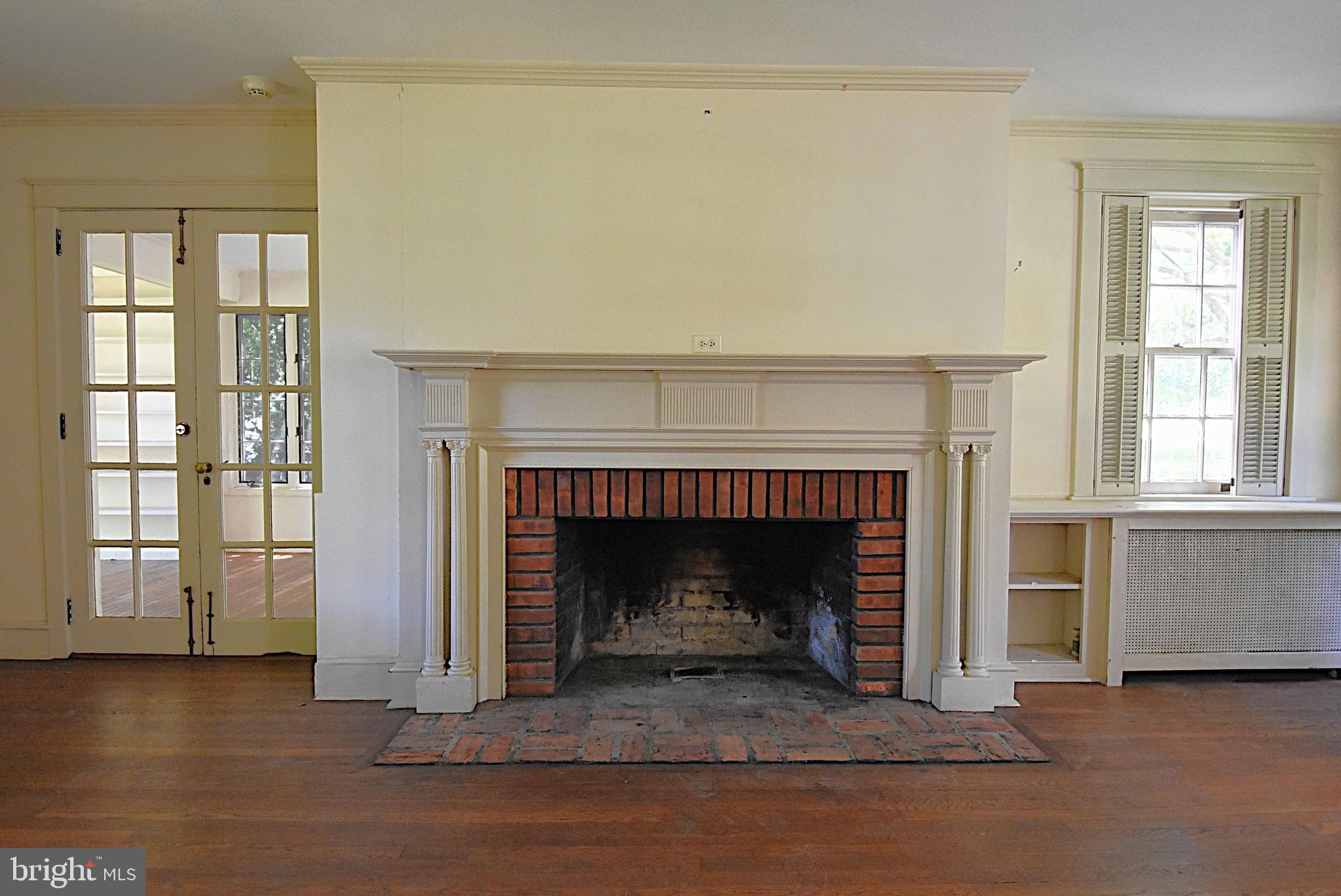 19 Farm Road Wayne, PA 19087 - Photo 9 of 41 a living room with a fireplace